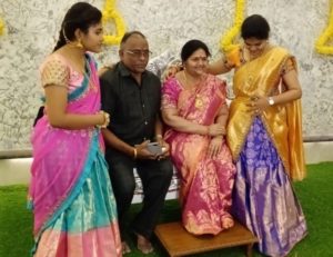 srinivas with his daughters and wax statue of his wife